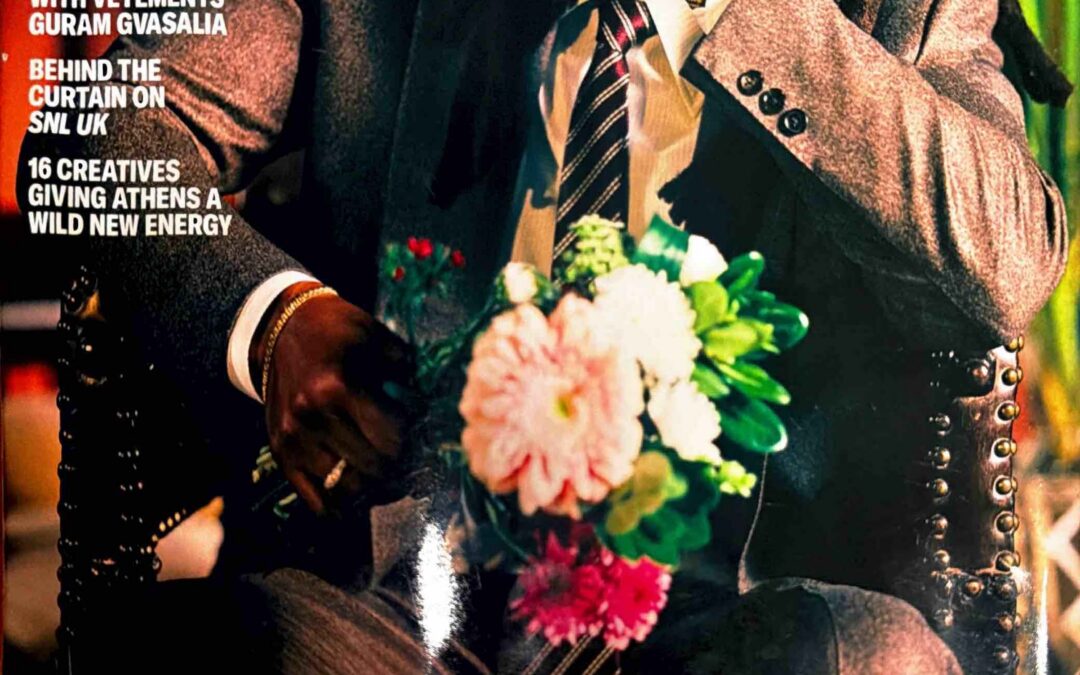 GQ magazine cover featuring Jay-Z (Shawn Carter) in a gray suit, looking pensively to the side, holding a bouquet of flowers; April/May 2026 issue.